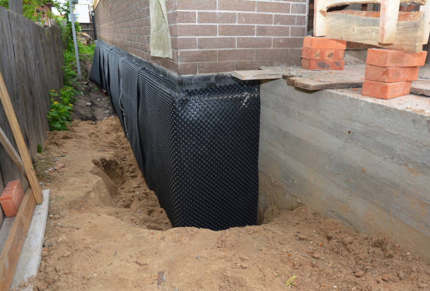 Happy homeowners after waterproofing job in Menominee